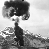 Smoke rising over Dutch Harbor from Japanese bombing. click here for full image